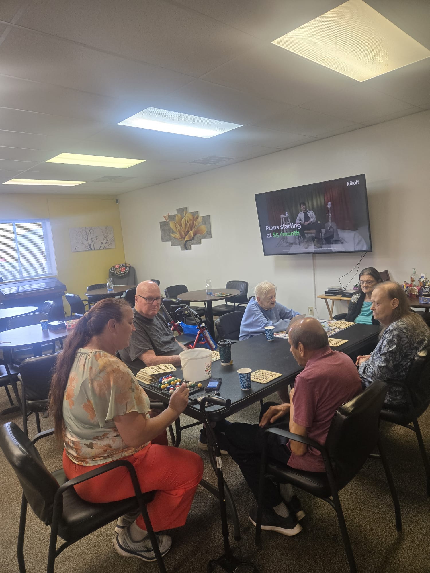 Participants playing bingo and puzzles together